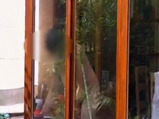 Neighbour cleaning windows.