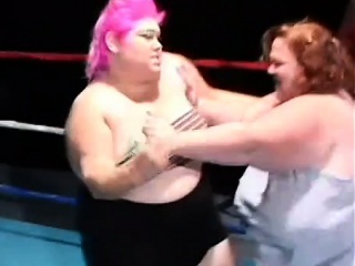 Chubby ladies play with a dildo and share a midget's cock in the ring